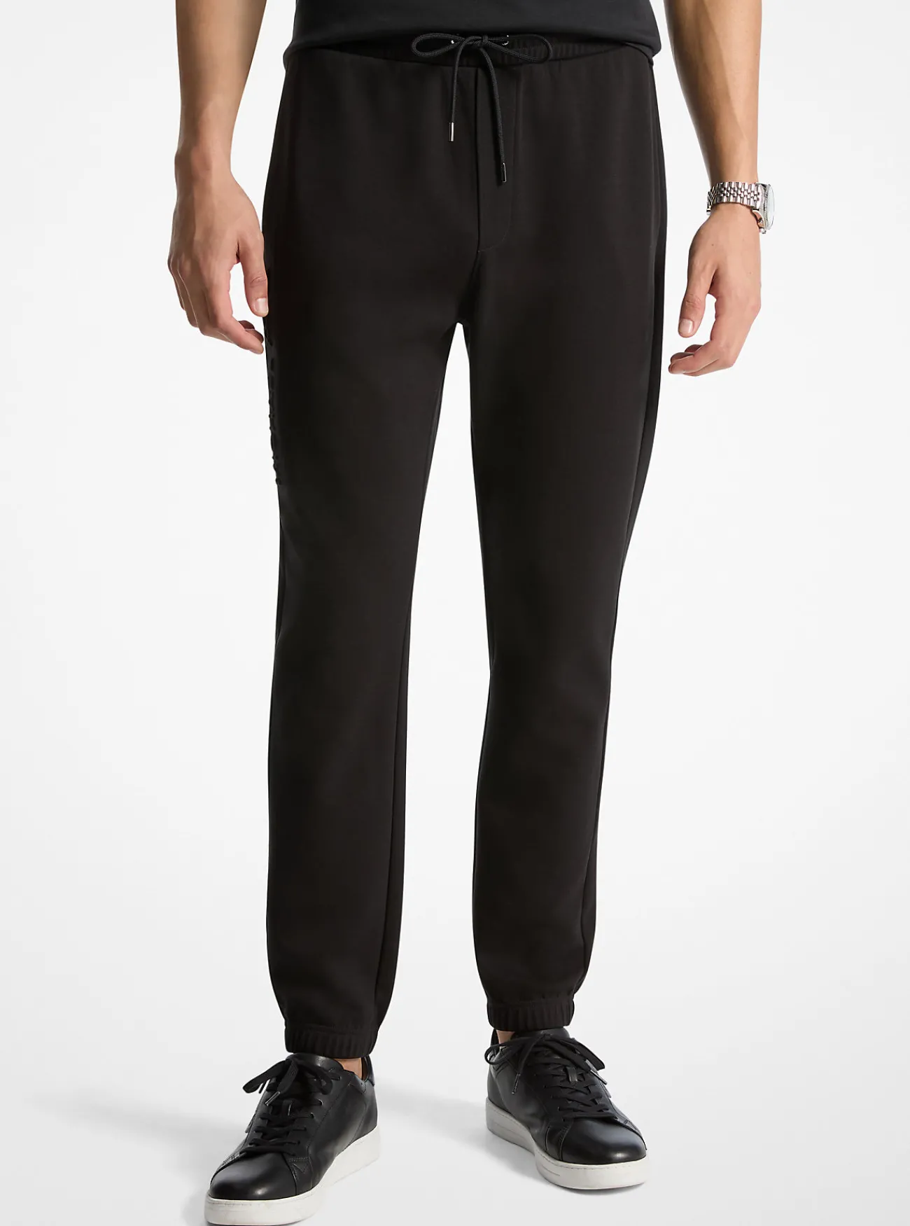 Michael Kors Joggingbroek van katoenmix met logo in reli&euml;f ZWART Online